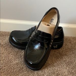 Alegria black patent slip on